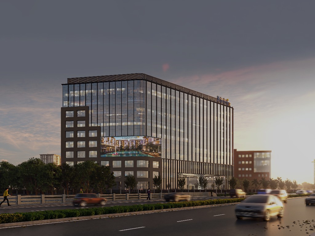 Dusk view of a Casagrand commercial building along a city boulevard